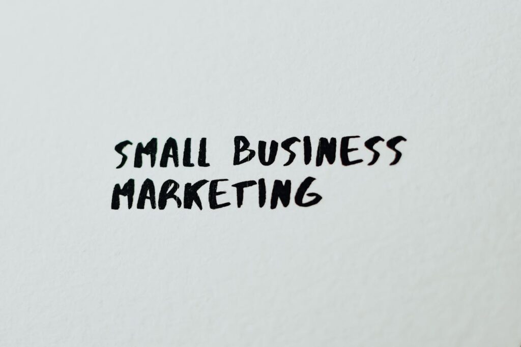 Mastering the First Impression: Your intriguing post title goes here Text 'Small Business Marketing' written on white paper for creative use.